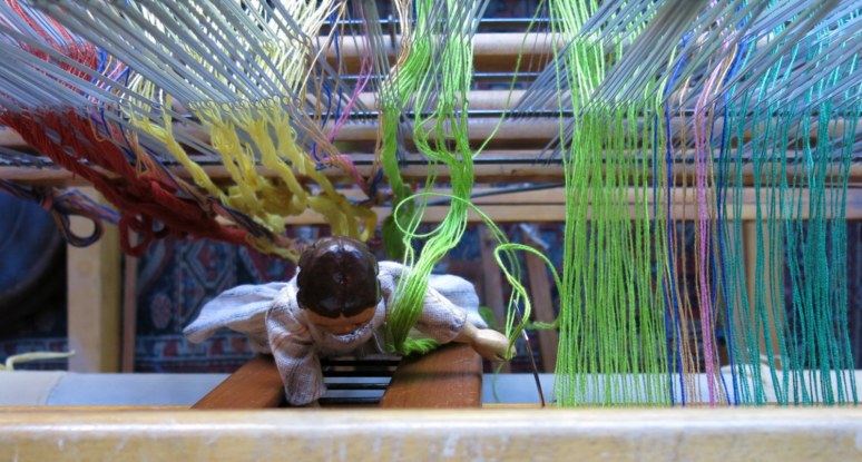 Constance helps sley the reed.