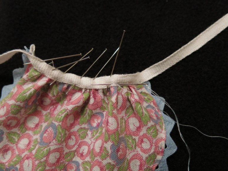 Sewing on the apron ties